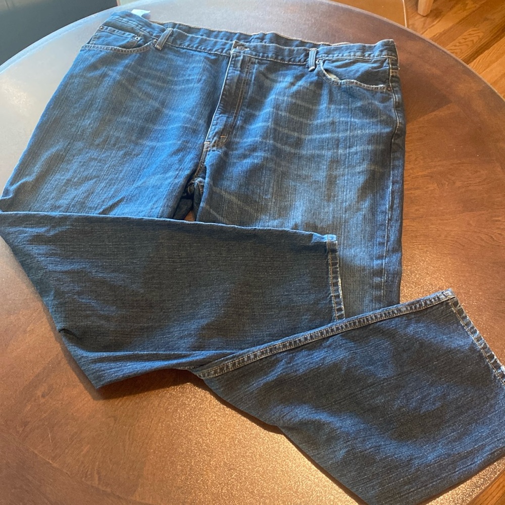 Levi”s 550 lightly distressed feathered medium wash straight leg jeans 48X32